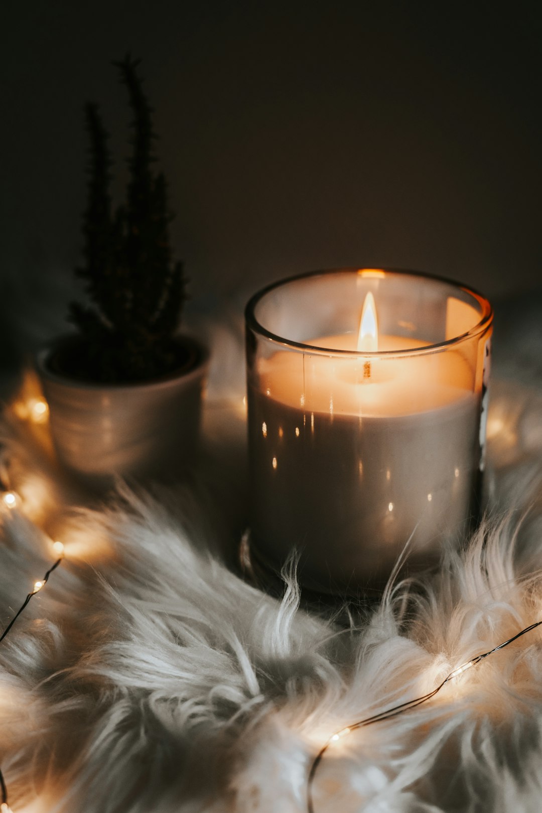 Photo by Joyce G lighted candle in the dark