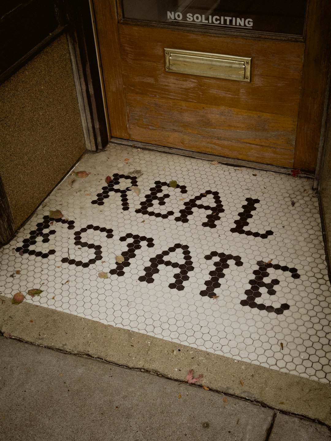 Photo by Jon Tyson a door with a sign that says real sale on it