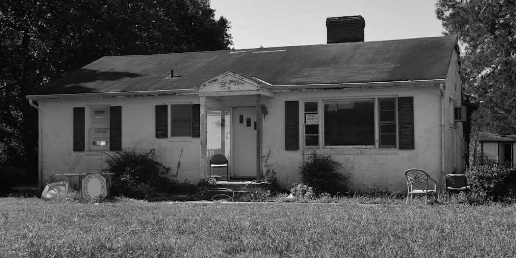 grayscale photo of 2 storey house
