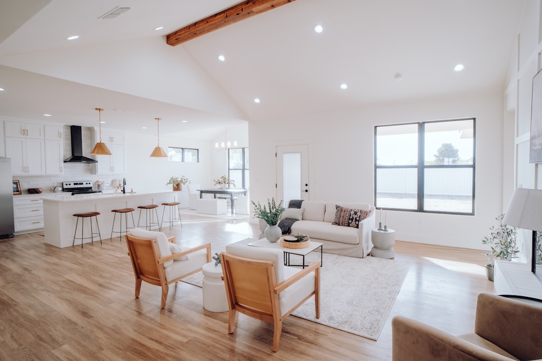 Photo by Bailey Alexander a living room filled with furniture and a kitchen