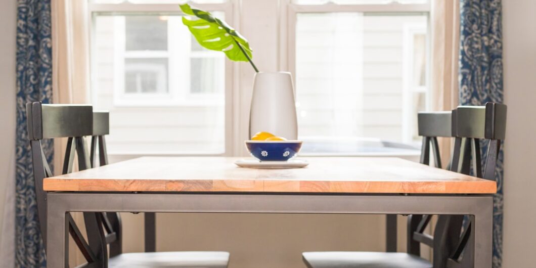 brown dining table and four chairs