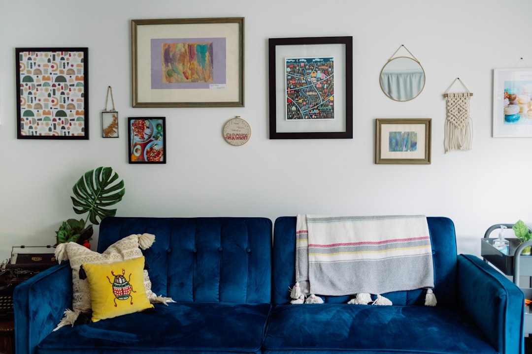 Photo by Taylor Heery blue sofa with white and blue towel