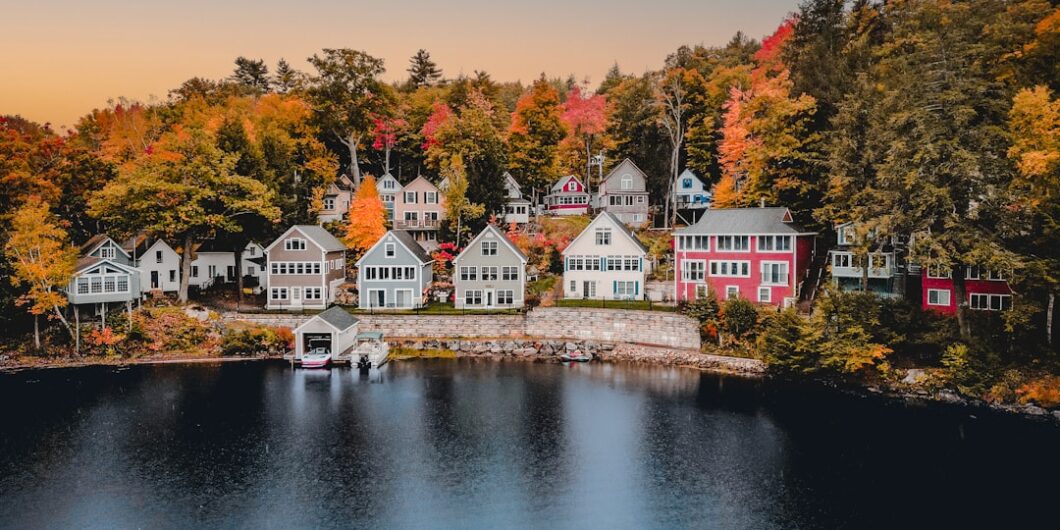 a group of houses next to a body of water